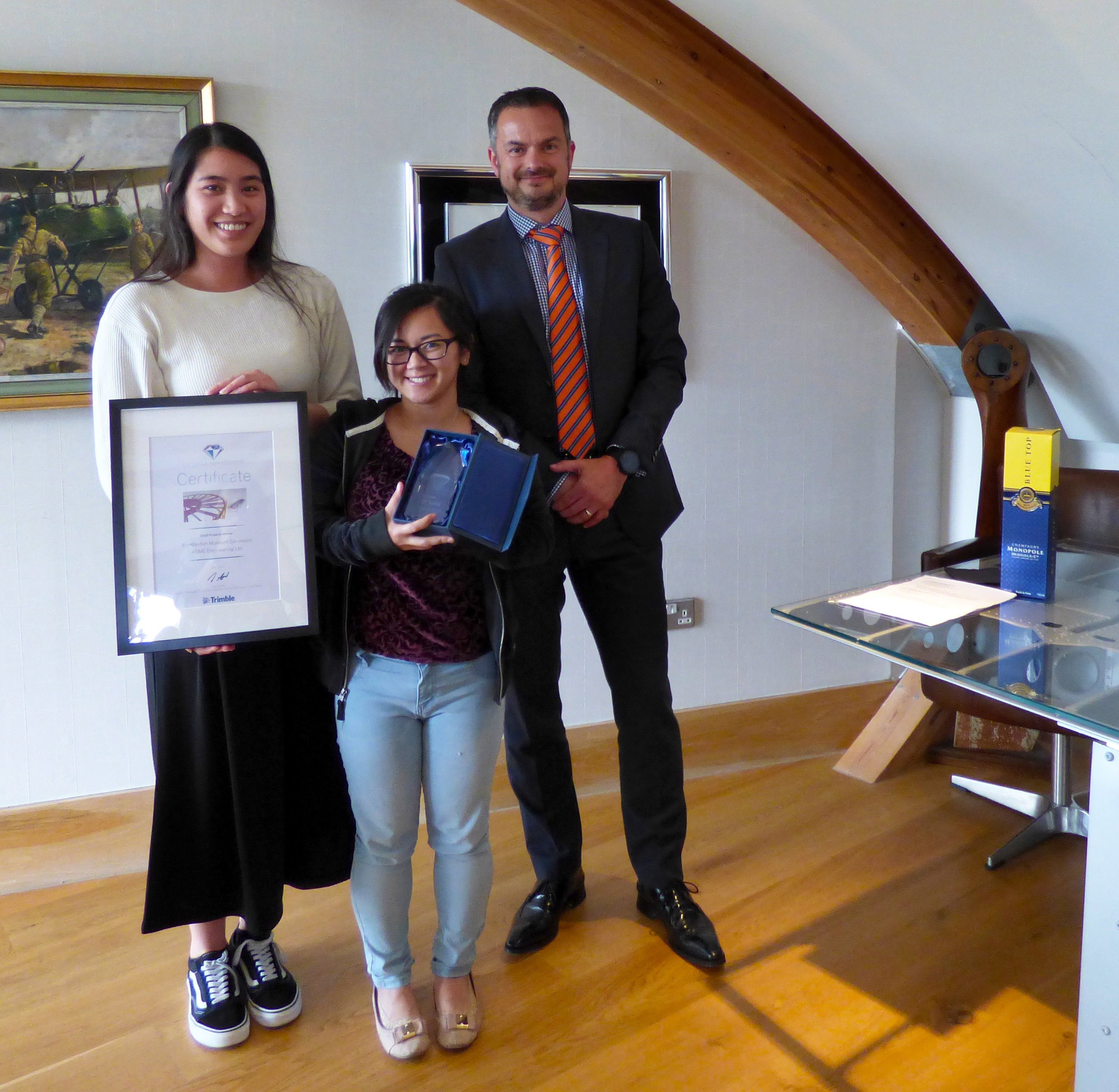 Kim Concepcion (HSEQ Systems Administrator) and Shiela Narito (Drawing Office Manager) with Richard Fletcher (Managing Director of Trimble UK)